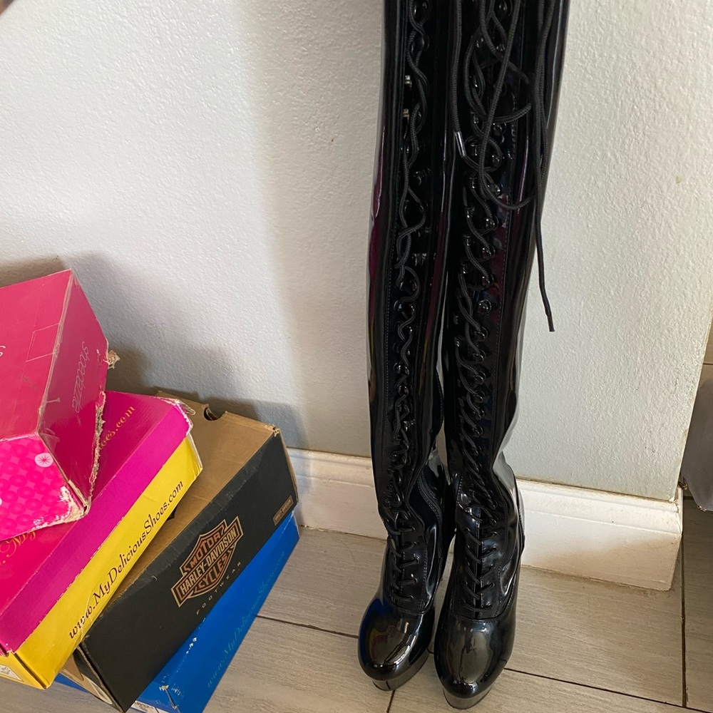 Thigh high lace up stiletto boots. Sexy!!